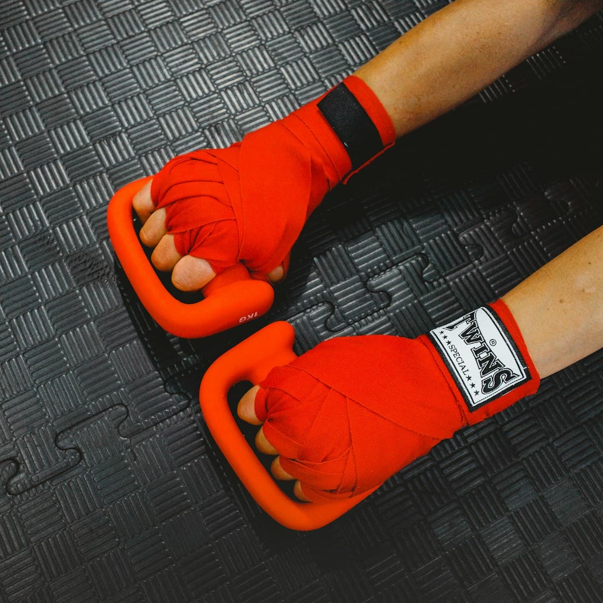 Boxer wrapping hands before training